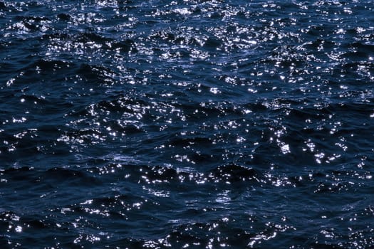 Atlantic ocean waves sparkling in the gentle soft waves