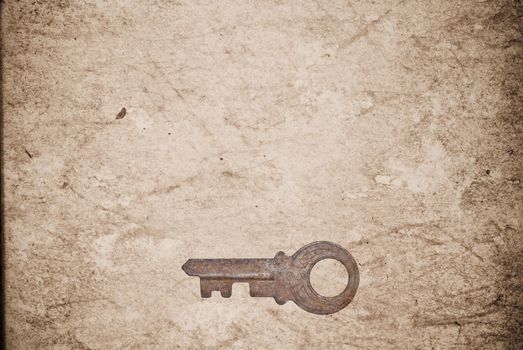 Rusty keys on old paper background with blended layers