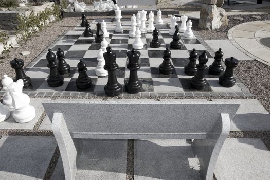 giant chess pieces in a park on a bright day outdoors