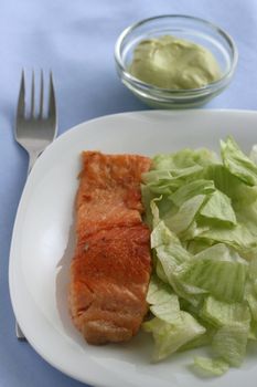 fried salmon with salad