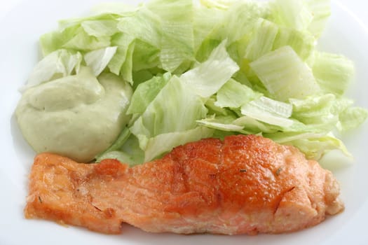 fried salmon with salad