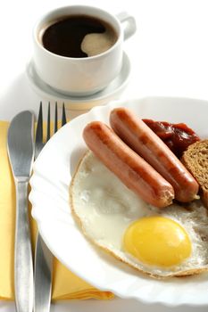 sausage with egg and a cup of coffee