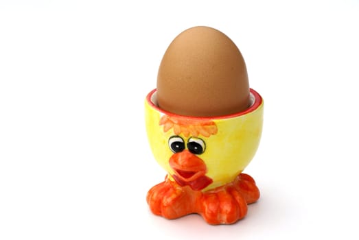 Ducky egg cup with egg in it.