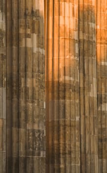 Dusk lighting detail of the Brandenburger Gate's columns in Berlin.