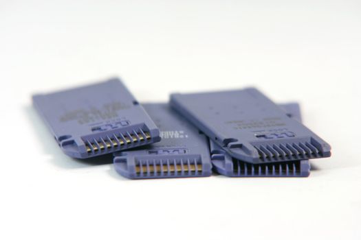 blue memory cards closeup in white background