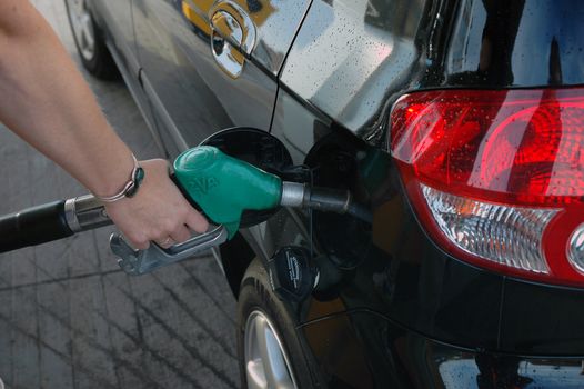 Lady filling fuel.
Norway.