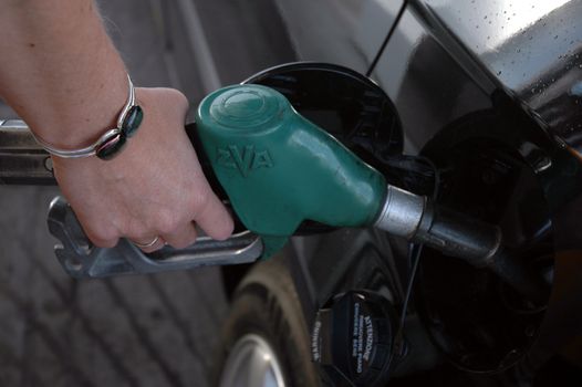 Lady filling fuel.
Norway.