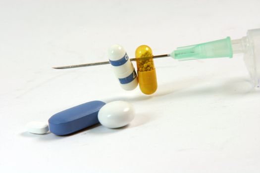 medical concept pills barbecue with needle in white background