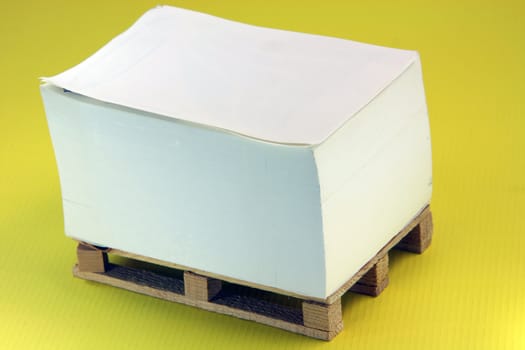 wooden paper palete miniature in yellow background