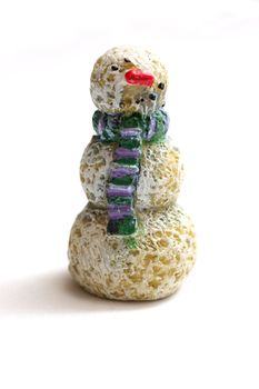 A wooden snowman figurine on white background