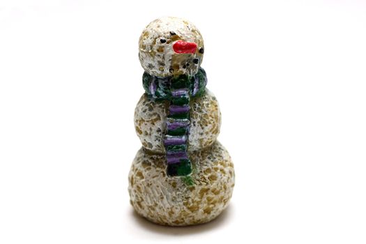 A wooden snowman figurine on white background