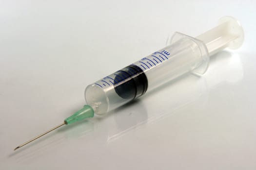syringe and needle closeup medical concepts prespective