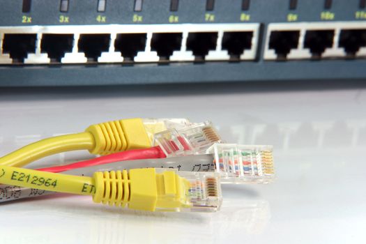 colorful ethernet cables with router ports blur background