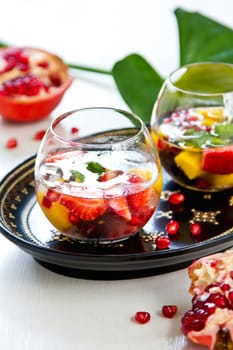 Mango with strawberry,grape and  pomegranate sangria