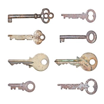 A collection of rusty old keys in isolated white background
