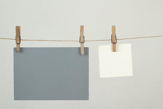 white and grey memory note papers hanging on cord