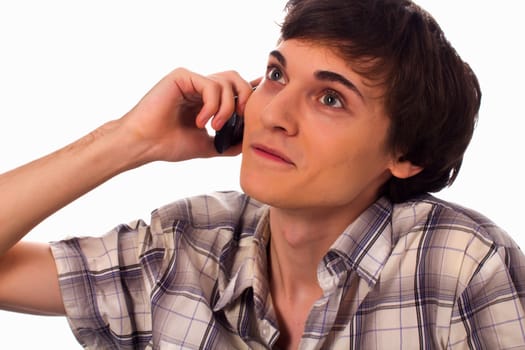 Young man having converstion by phone on white background