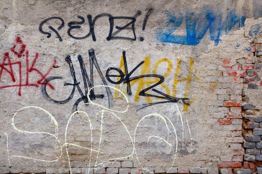 grunge background with graffiti elements on brick wall