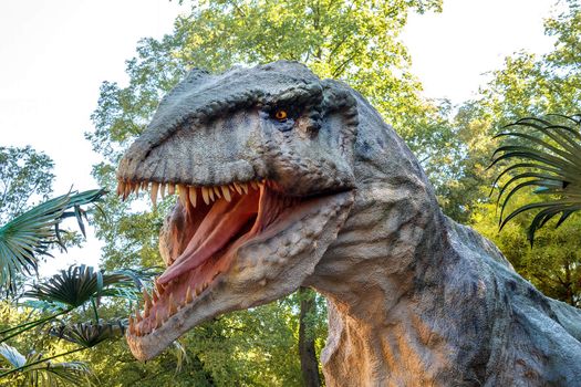 model of big tyranosaurus rex in the jungle