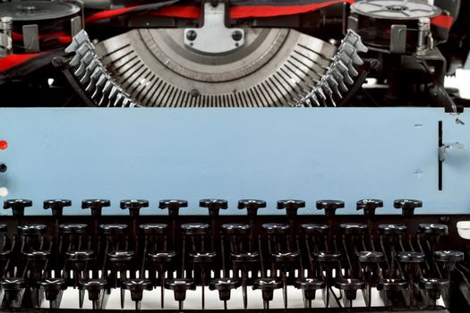 retro typewriter close up with number keys and letters mechanism
