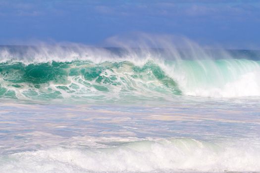 The dream of every surfer to find waves like this. These waves are at pipeline on the north shore of Oahu during the winter in a huge storm.