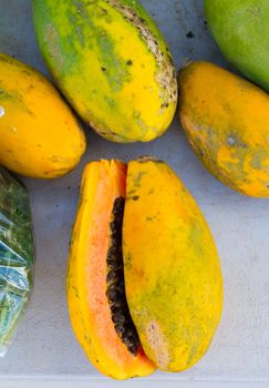 Perfect papayas served in Hawaii are a great tropical fruit to eat for breakfast. This papaya is cut down the middle showing the dark seeds in the center.