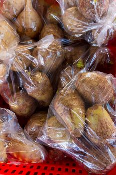 Images from a farmers market in Hawaii showing tropical fruits or vegetables in simple photos with vibrant colors.