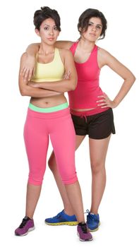 Confident young women in workout clothes on white background