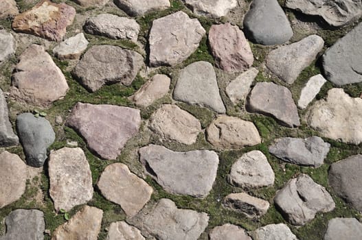 Closeup of old cobblestone pavement surface