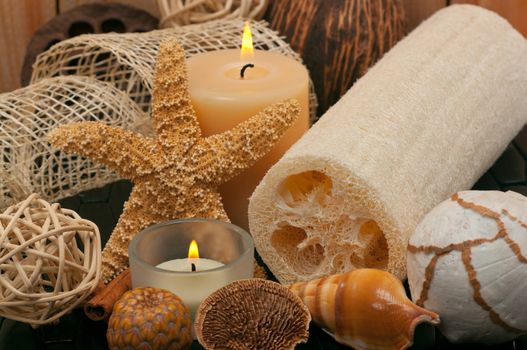 Spa concept with aromatic candles, decorations and loofah