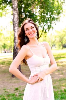 Portrait of an attractive woman in the park, smile and happy