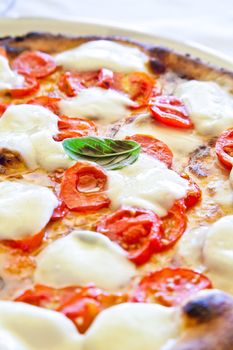 This is a true Italian Pizza. Traditional Pizza Margherita served in a Capri's restaurant, Naples Gulf, Italy.