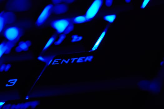 Enter key in a blue light. Macro shot. Shallow depth of field.