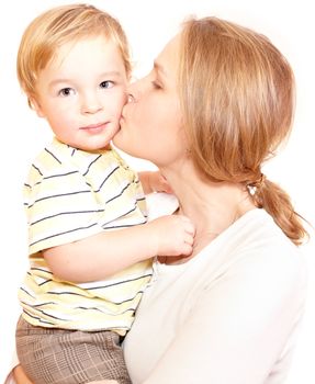 Young happy mother is embracing and kissing her child. Isolated on white.