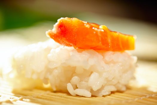 Rice with salmon. Macro shot with beautiful shallow dof illustrating making sushi process.