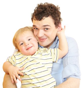 Young father with his son are smiling into the camera.