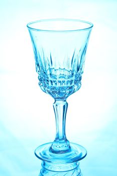 Ornate wine glass in a blue tinted light