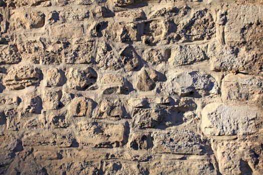 Material close up of cobbled portland stone construction material