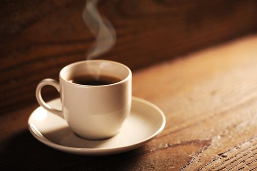 cup of coffee on the wooden table