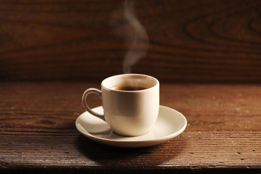 cup of coffee on the wooden table