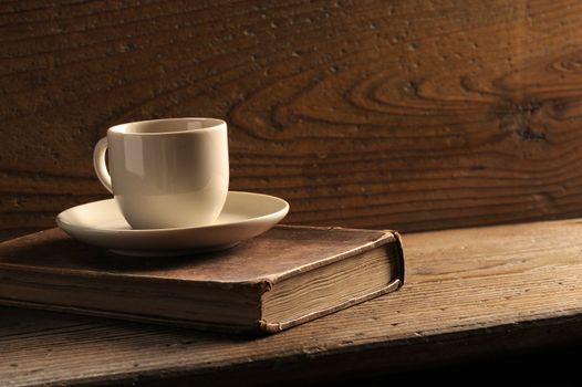 cup of coffee and old books