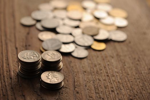 old coins on the wooden table, shallow dof