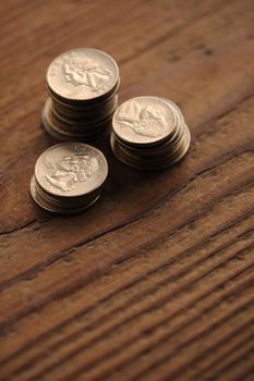 old coins on the wooden table, shallow dof