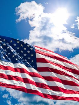 American Flag Before a Cloudy Blue Sky