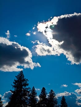 Bright Sun and White Clouds in a Blue Sky