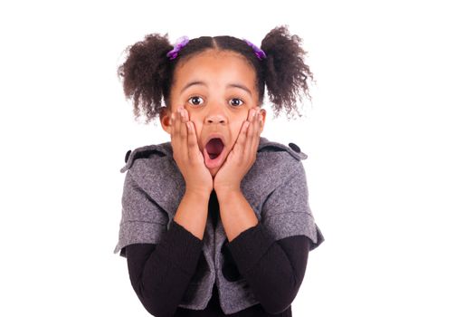 young African girl sticking tongue out, isolated on white background