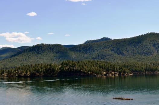 Black hills and water background