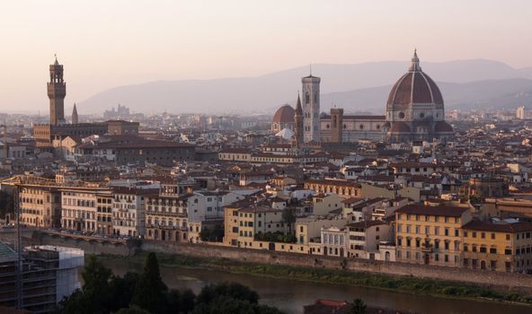 Florence (Firenze) Italy, skyline shot at dusk.  Featuring the Florence Cathedral (Basilica of Saint Mary of the Flower, ie the Duomo), the Arno River and the Palazzo Vecchio.
