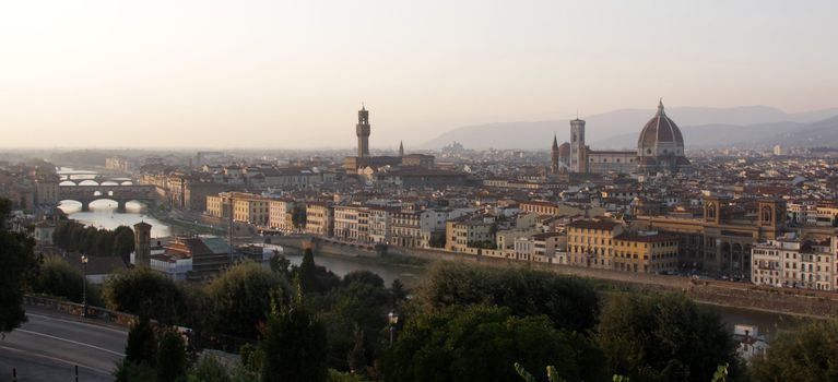Florence (Firenze) Italy, skyline shot at dusk.  Featuring the Florence Cathedral (Basilica of Saint Mary of the Flower, ie the Duomo), the Arno River and the Palazzo Vecchio.
