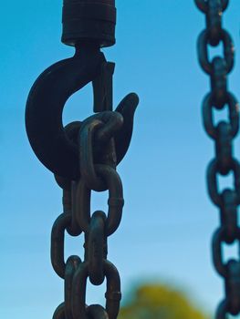 Large metal hook and chains attached to a pulley